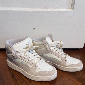 Off-white/cream Pumas for women